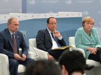 Олланд и Меркель призвали Путина способствовать прекращению огня на Украине