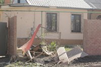 «Беспорядочный огонь»: из-за боев у донецкого аэропорта разрушены дома (Видео)