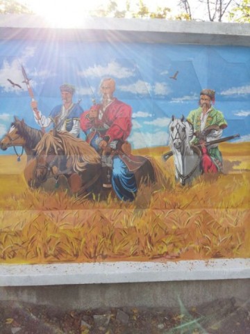 Стрит-арт на заборе воинской части